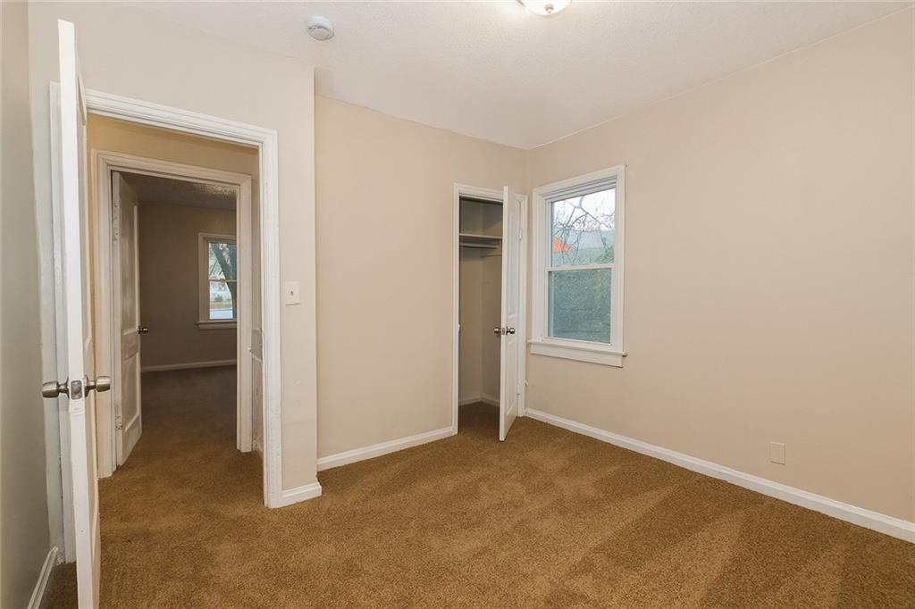 1944 Washington Road East Point, GA 30344 - Photo 8 of 14 a view of an empty room with closet and a window