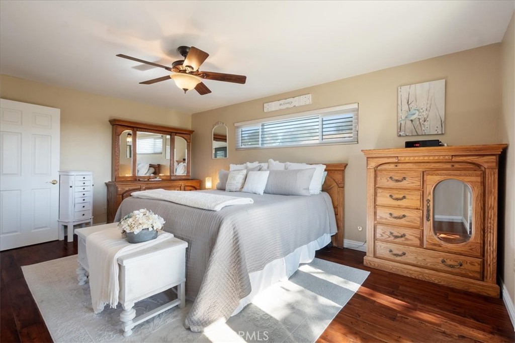 1321 June Street Fallbrook, CA 92028 - Photo 19 of 44 a bedroom with a bed and wooden floor