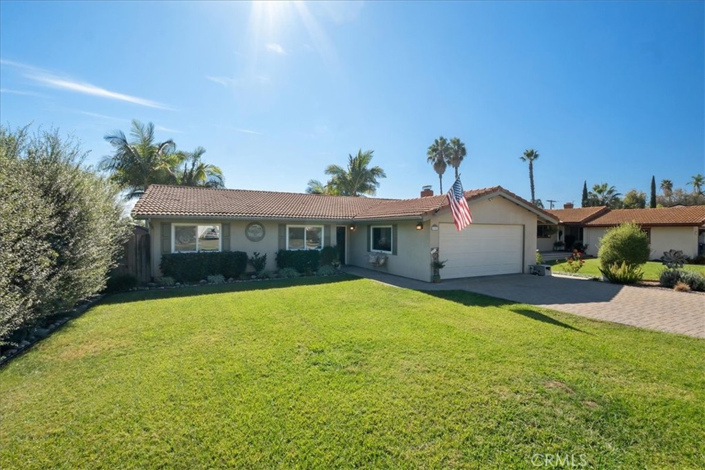 1321 June Street Fallbrook, CA 92028 - Photo 2 of 44 a front view of a house with a yard and garage