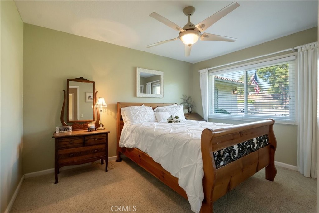 1321 June Street Fallbrook, CA 92028 - Photo 23 of 44 a bed room with a bed and a chandelier