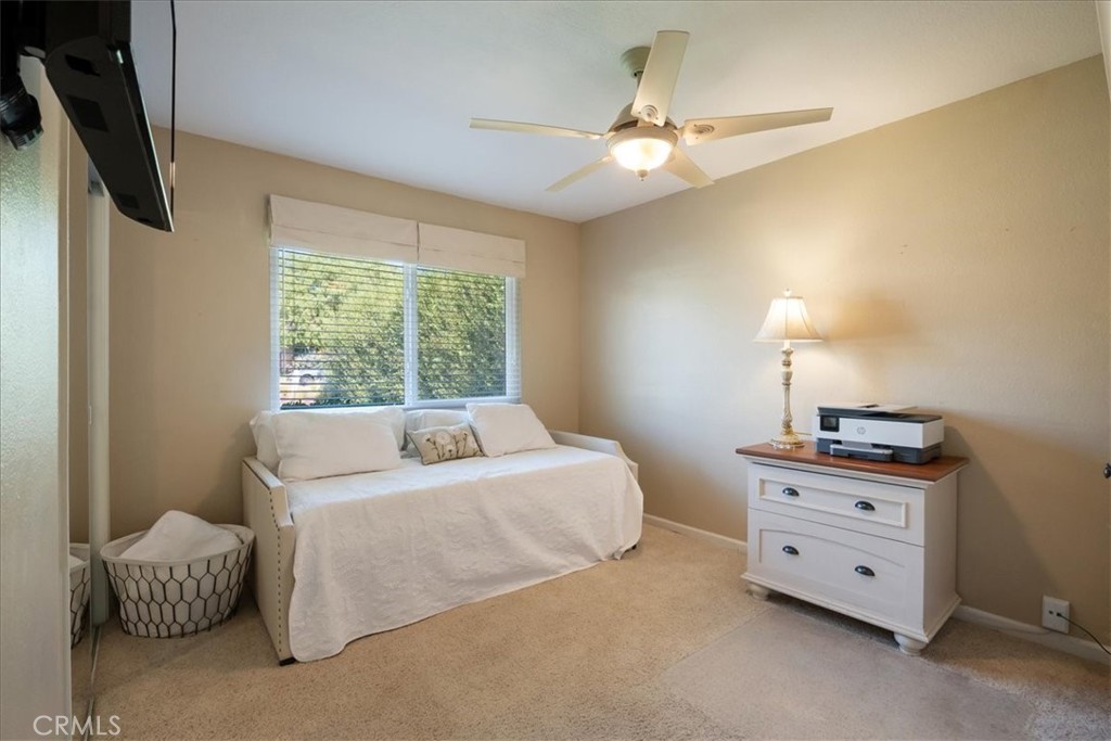 1321 June Street Fallbrook, CA 92028 - Photo 25 of 44 a bedroom with a bed and a chandelier