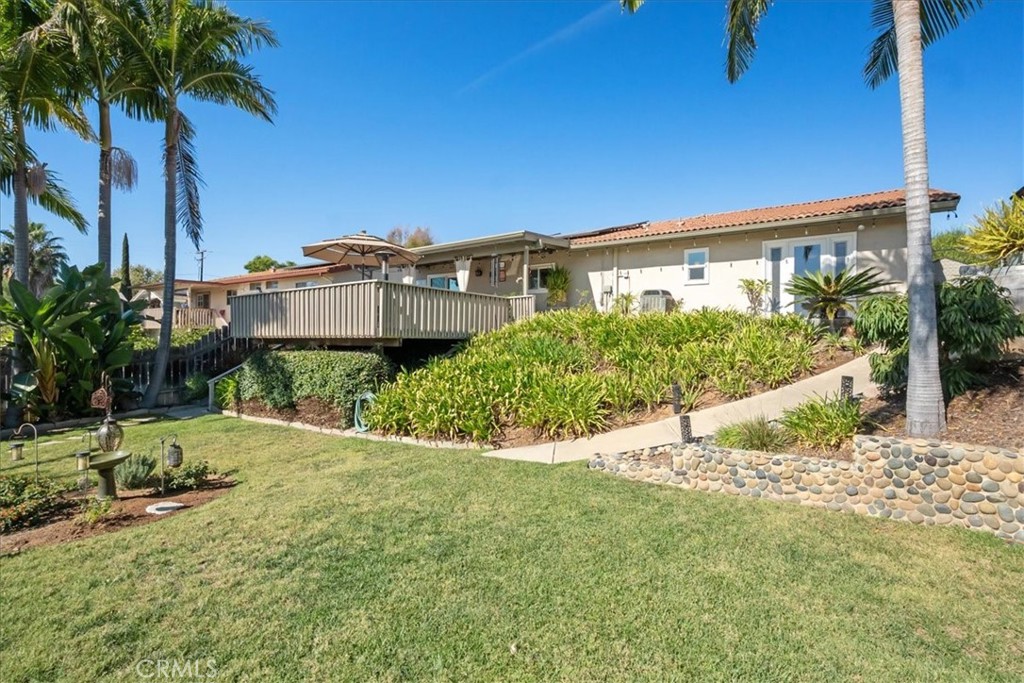 1321 June Street Fallbrook, CA 92028 - Photo 42 of 44 a view of a house with a yard and potted plants
