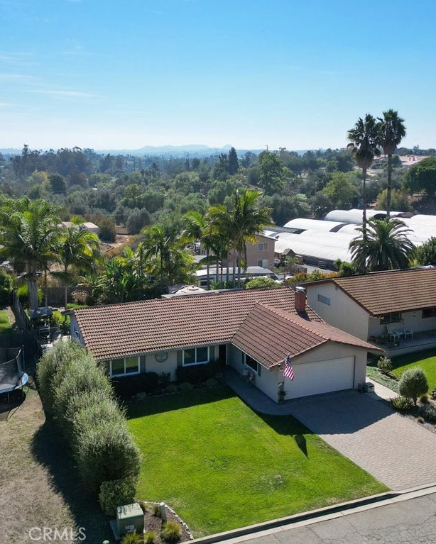 1321 June Street Fallbrook, CA 92028 - Photo 43 of 44 a view of a patio with table and chairs and potted plants