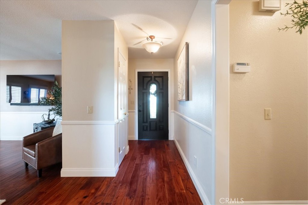 1321 June Street Fallbrook, CA 92028 - Photo 5 of 44 a view of a hallway with wooden floor and staircase