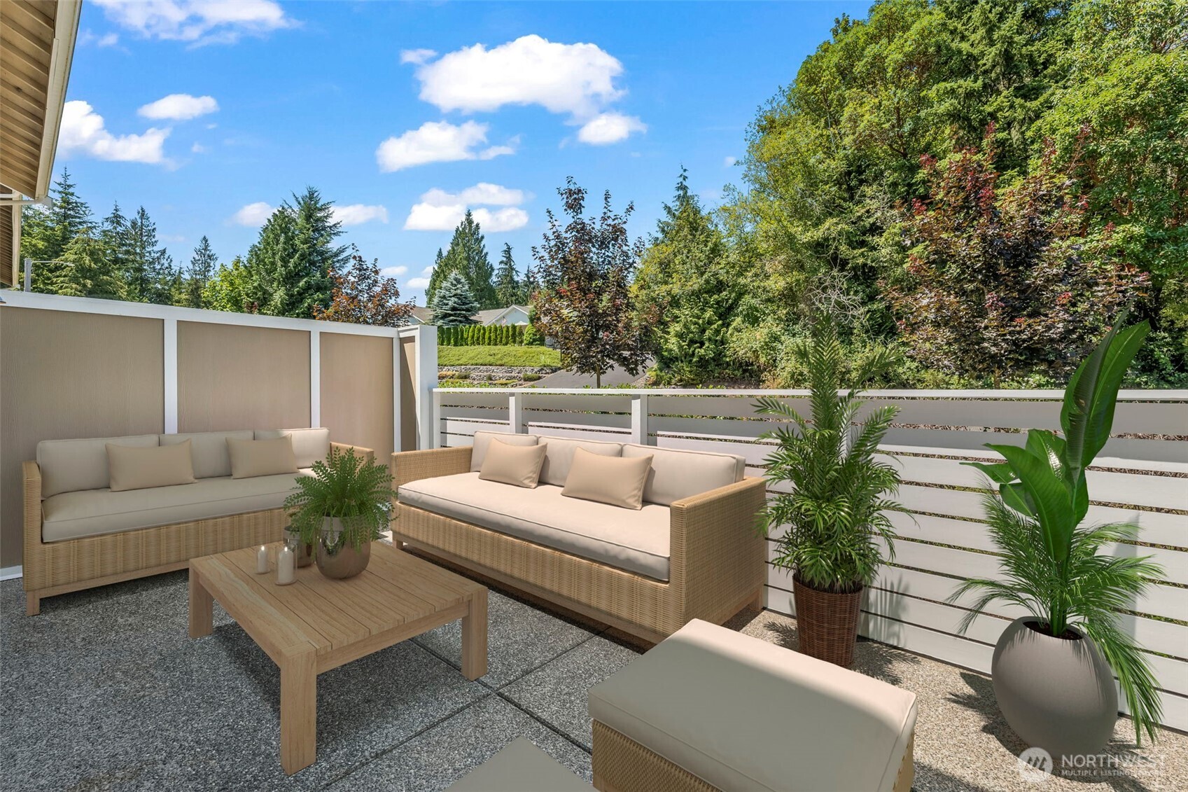 920 East Old Ranch Road, Unit E1 Allyn, WA 98524 - Photo 11 of 20 a view of a patio with couches table and chairs with potted plants and wooden fence