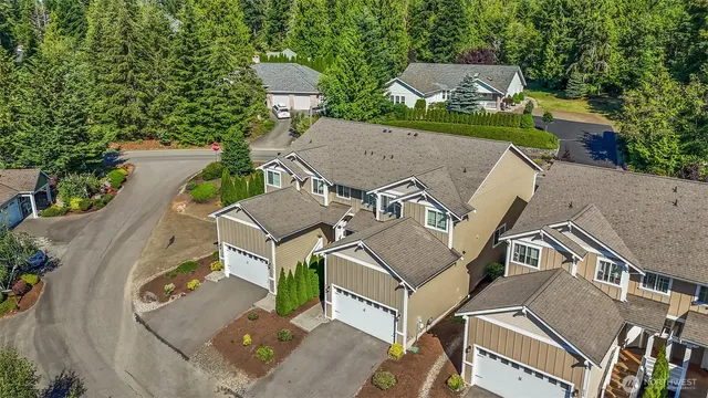 an aerial view of a house with outdoor space