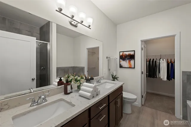 a bathroom with a double vanity sink and a mirror