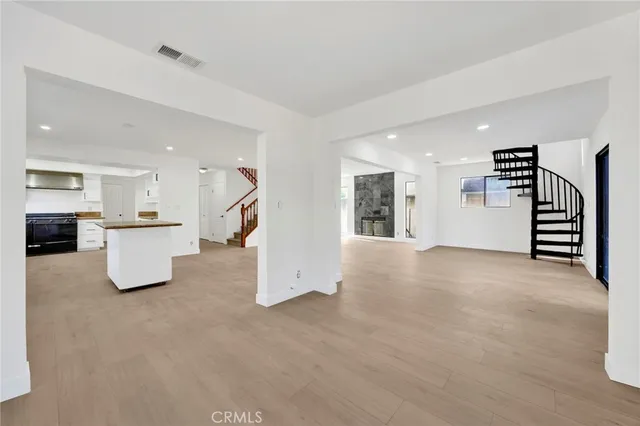 a view of a kitchen with furniture and cabinets