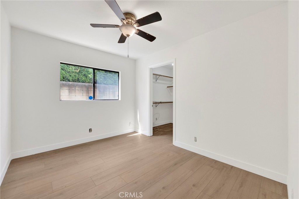 20243 Lanark Street Winnetka, CA 91306 - Photo 19 of 38 an empty room with a ceiling fan and a window