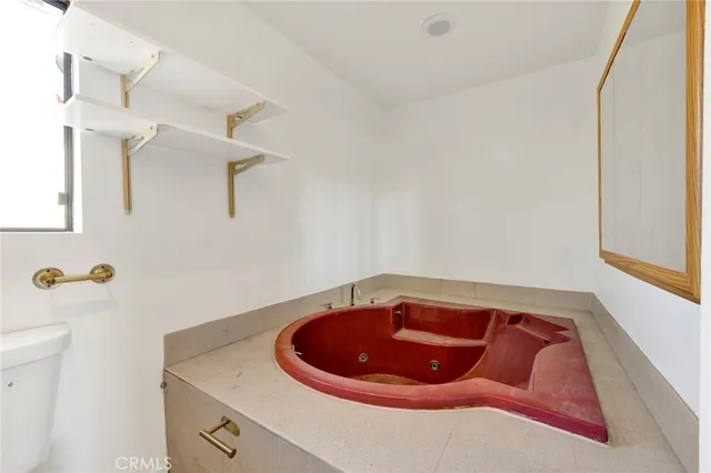 a bathroom with a sink and mirror