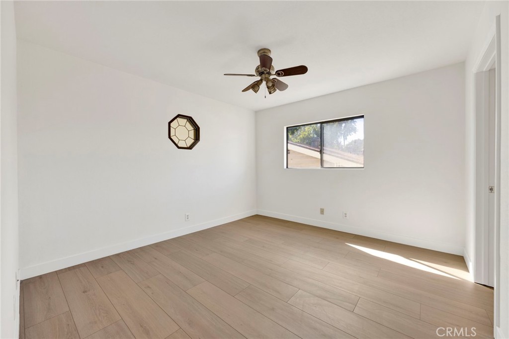 20243 Lanark Street Winnetka, CA 91306 - Photo 31 of 38 an empty room with windows and fan