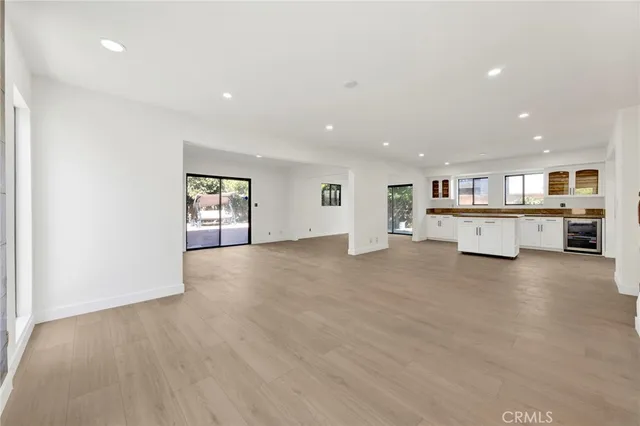 a view of kitchen and refrigerator