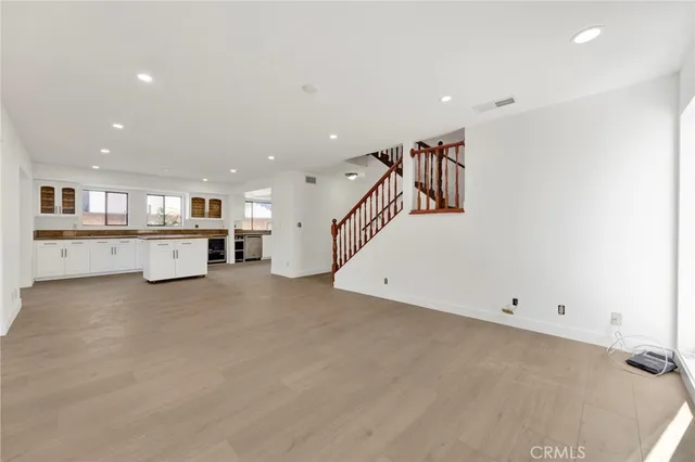 a view of a kitchen with a sink and cabinets