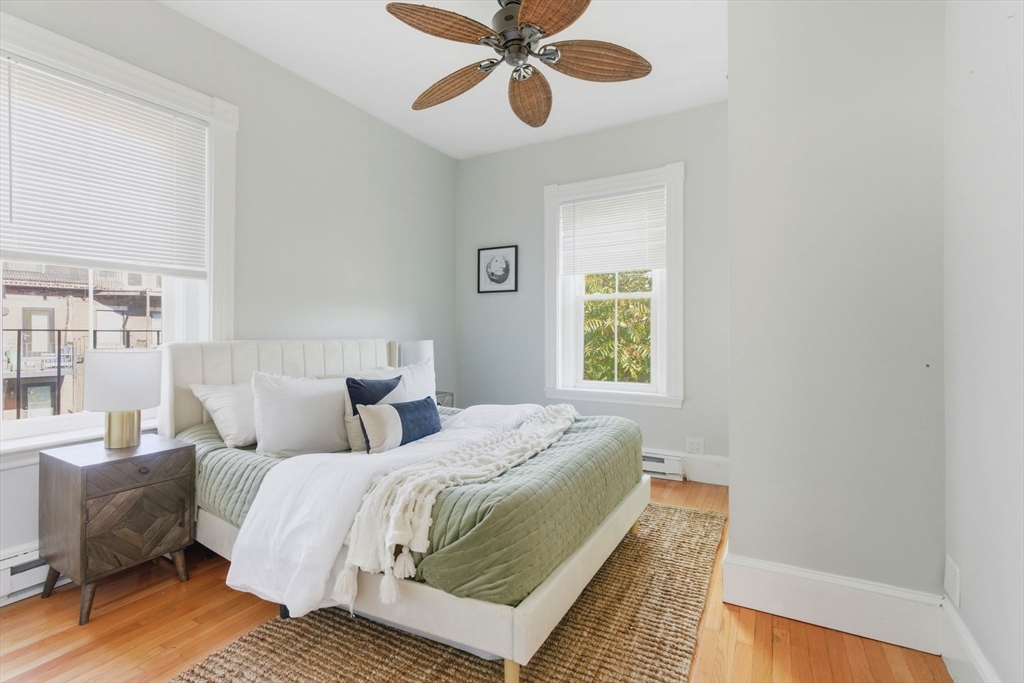 592 Columbus Avenue, Unit PH1 Boston, MA 02118 - Photo 4 of 9 a bedroom with a bed and a window