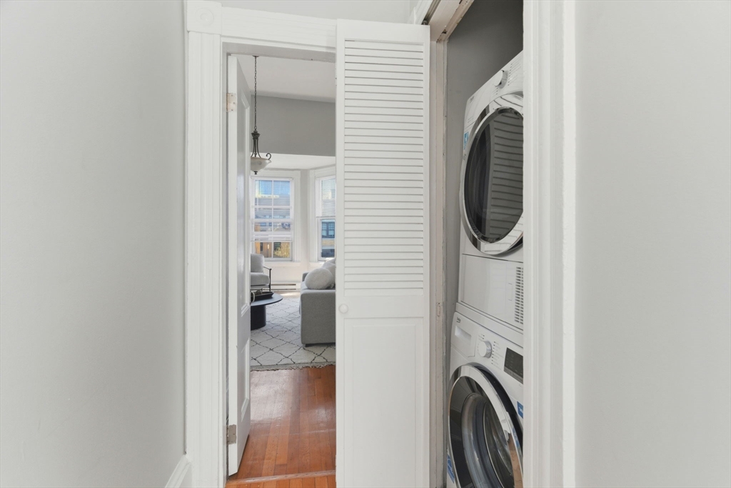 592 Columbus Avenue, Unit PH1 Boston, MA 02118 - Photo 7 of 9 a view of a kitchen with washer and dryer