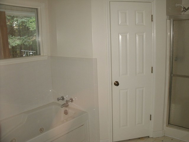 199 Cyler Road Gray, GA 31032 - Photo 11 of 23 a white bath tub sitting next to a window