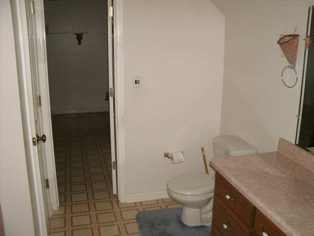 199 Cyler Road Gray, GA 31032 - Photo 12 of 23 a bathroom with a granite countertop toilet and a sink
