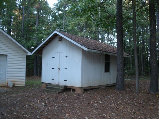 199 Cyler Road Gray, GA 31032 - Photo 21 of 23 a wooden house with a trees in the background