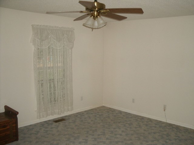 199 Cyler Road Gray, GA 31032 - Photo 10 of 23 a view of a room with a ceiling fan and window