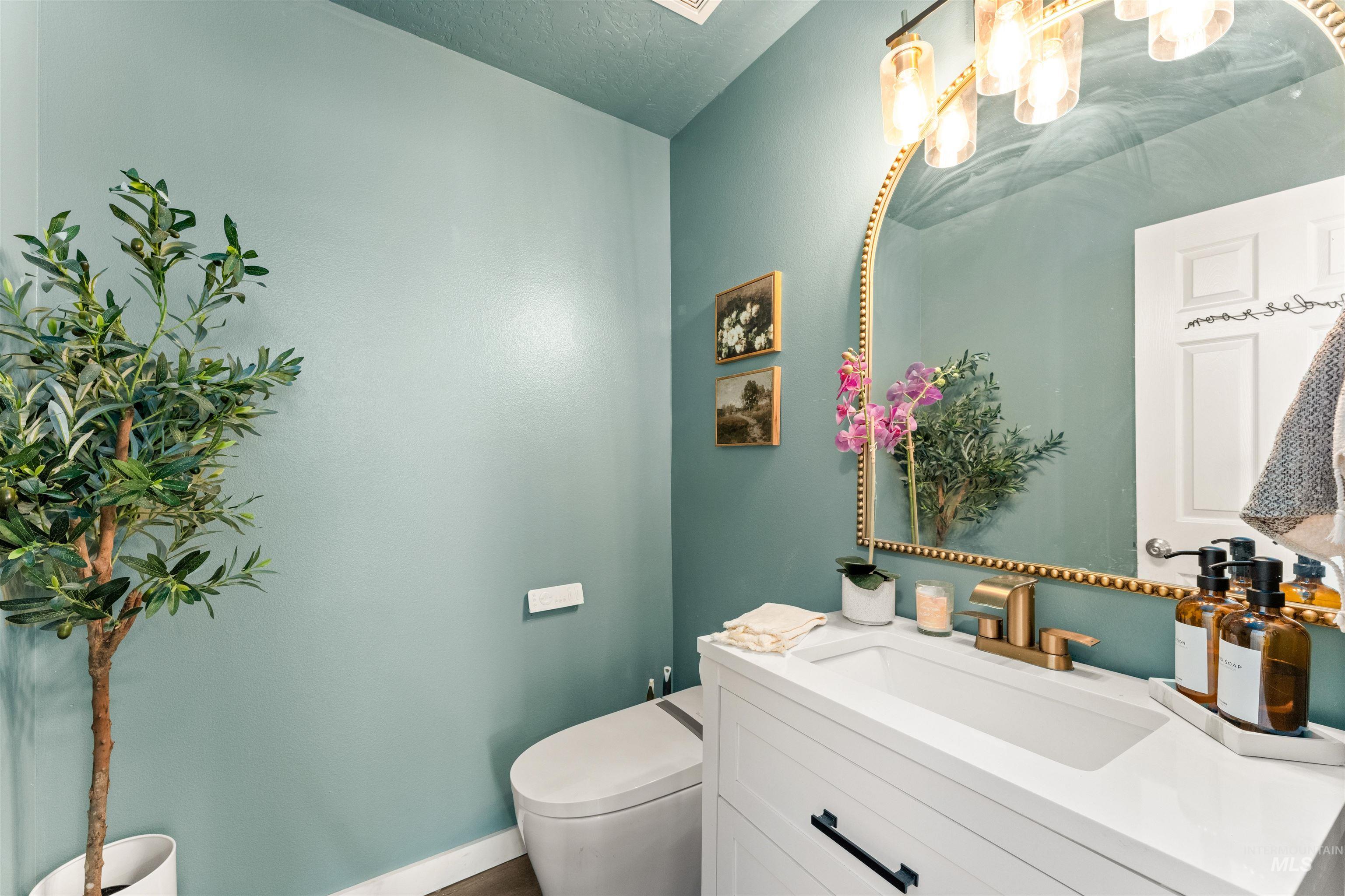 5021 Lathrop Place Caldwell, ID 83607 - Photo 18 of 43 Bathroom featuring vanity and a textured ceiling