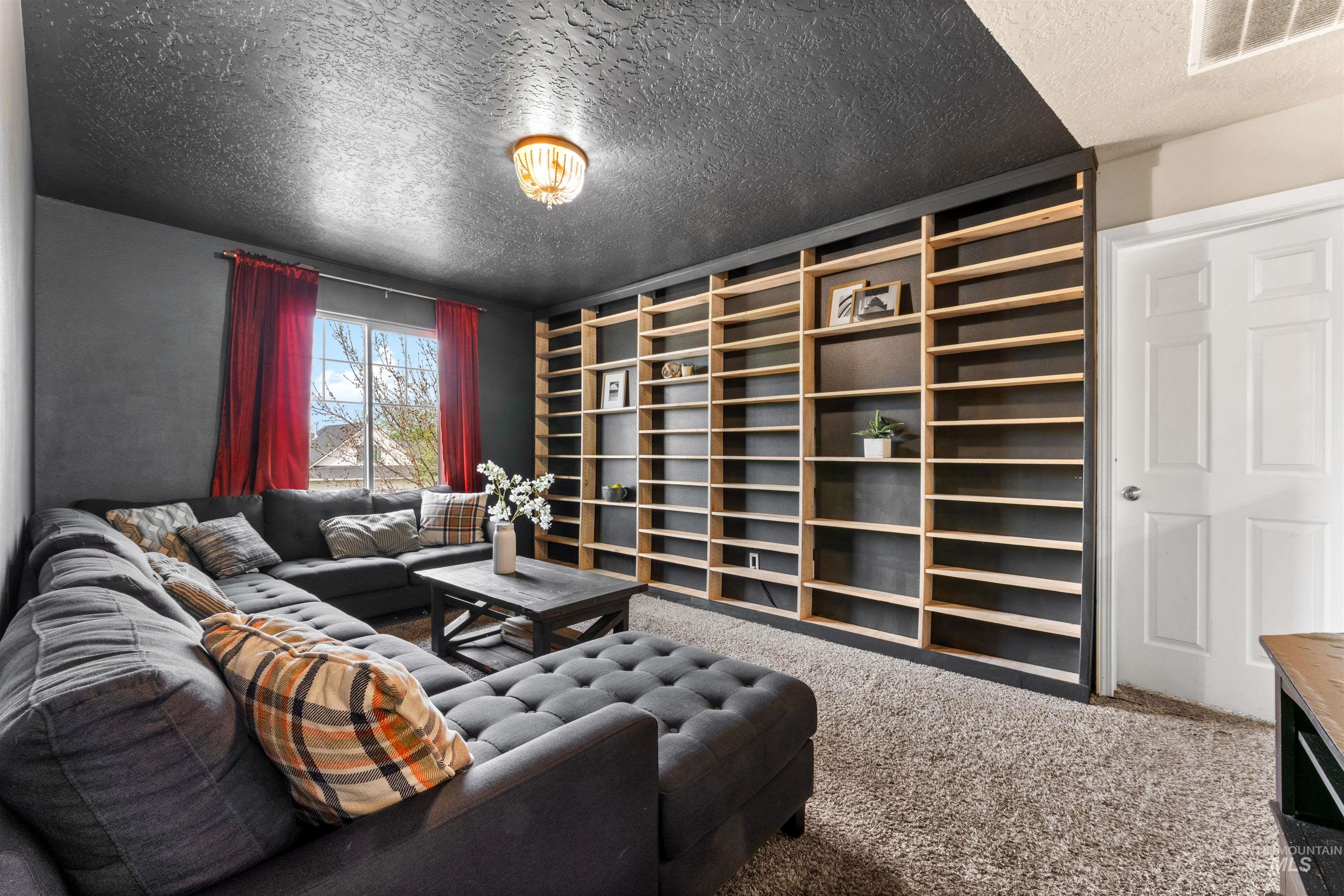 5021 Lathrop Place Caldwell, ID 83607 - Photo 31 of 43 Living area featuring a textured ceiling and carpet flooring