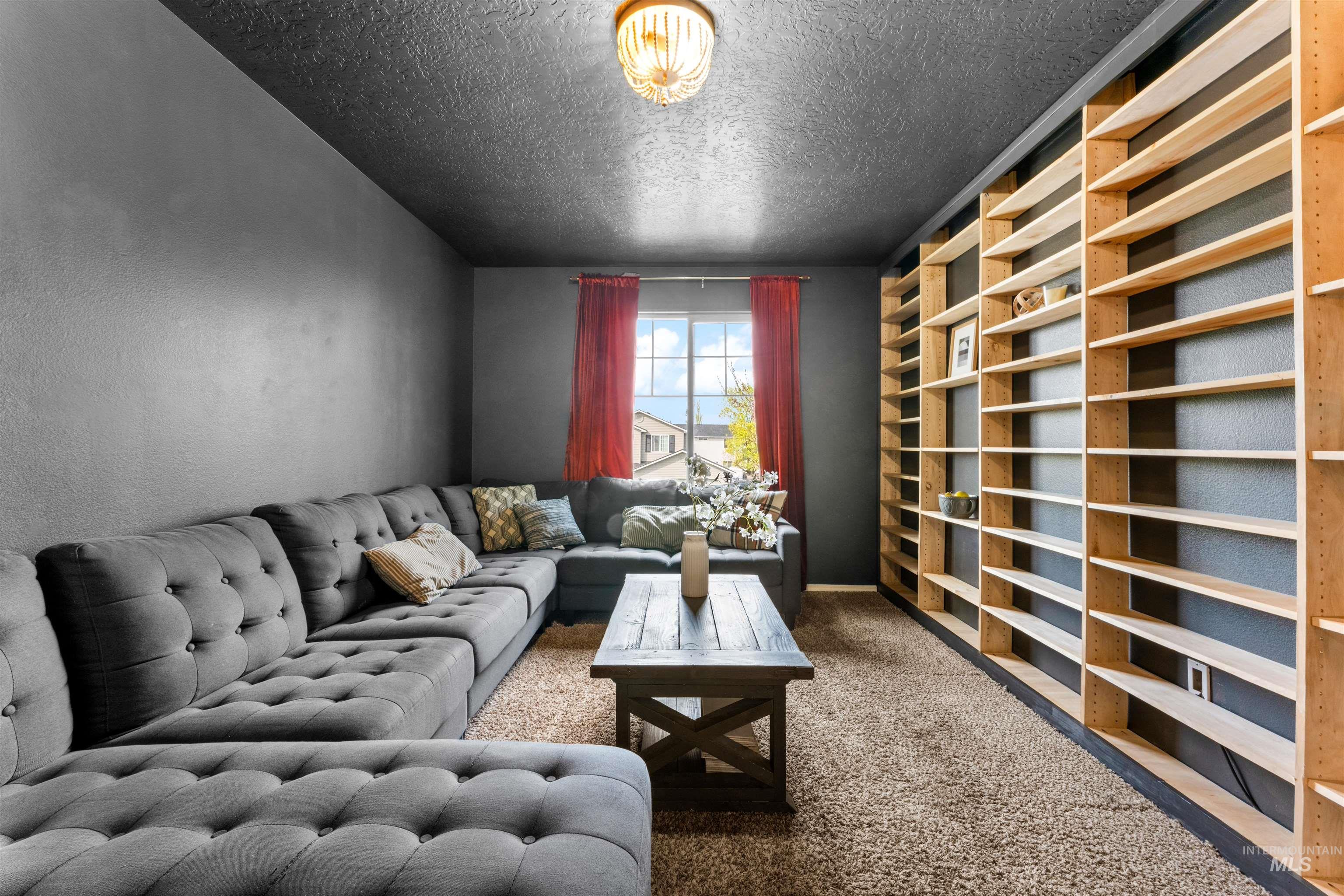 5021 Lathrop Place Caldwell, ID 83607 - Photo 33 of 43 Carpeted living area with a textured ceiling