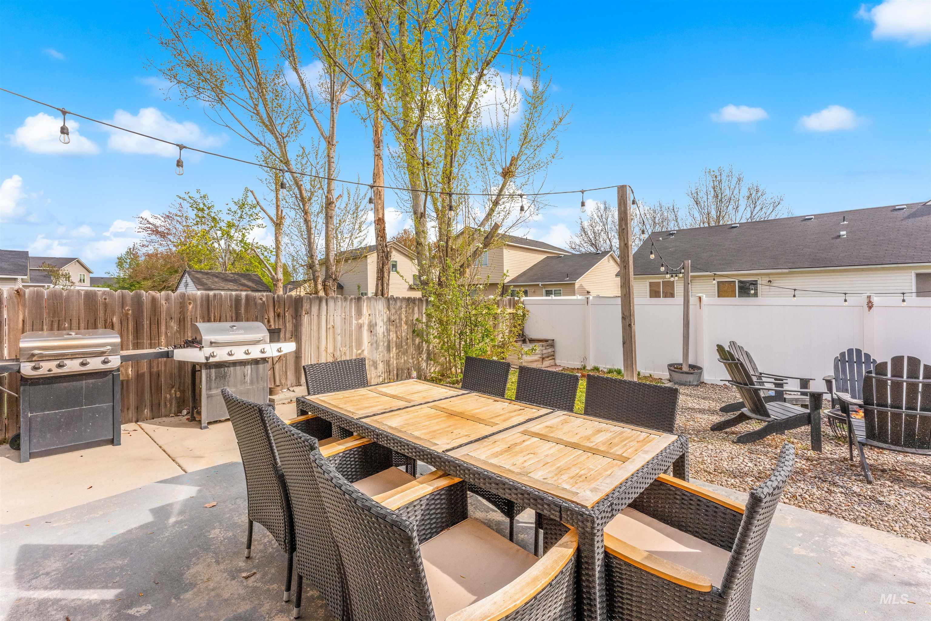 5021 Lathrop Place Caldwell, ID 83607 - Photo 37 of 43 Fenced backyard with a patio, outdoor dining space, and area for grilling