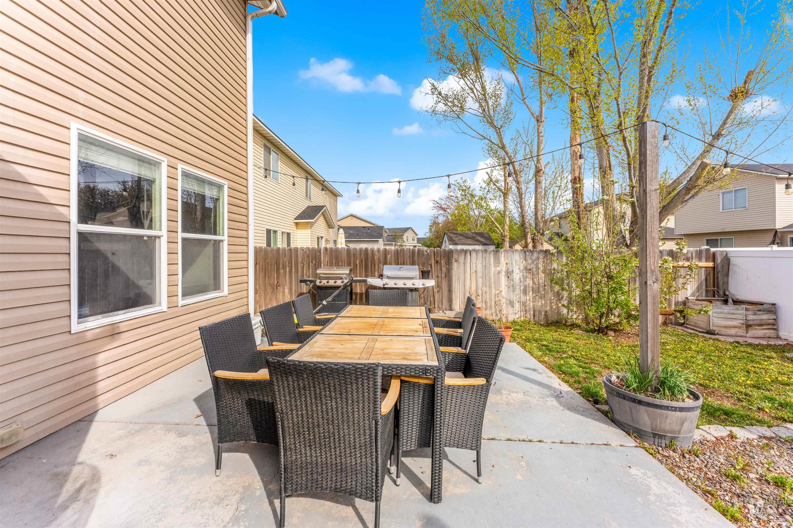 5021 Lathrop Place Caldwell, ID 83607 - Photo 38 of 43 Fenced backyard with a patio area, outdoor dining area, and grilling area