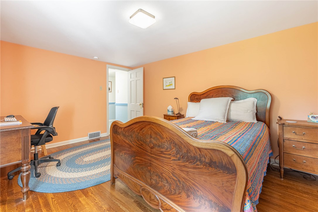 156 West Hadley Road Dayton, OH 45419 - Photo 30 of 71 This inviting bedroom features rich hardwood flooring, creating a comfortable and practical living space.