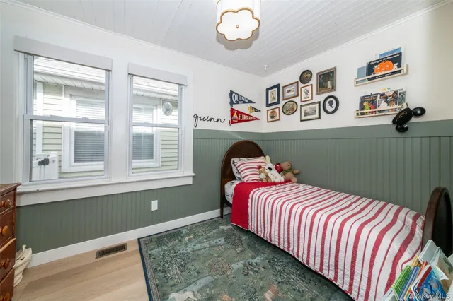 a bedroom with bed and a window