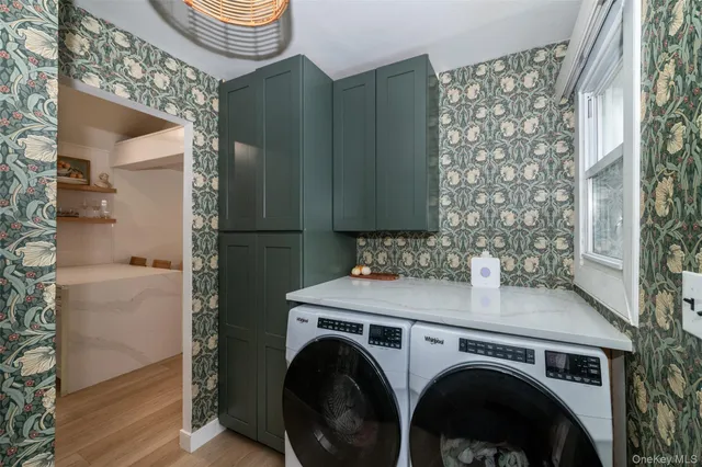a utility room with dryer and washer