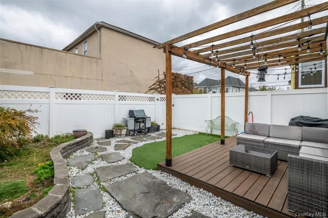 a view of a patio with couches table and chairs with potted plants