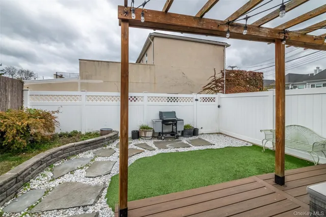 a view of a patio with chairs and table in the patio