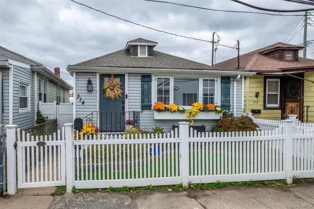 a front view of a house with a porch
