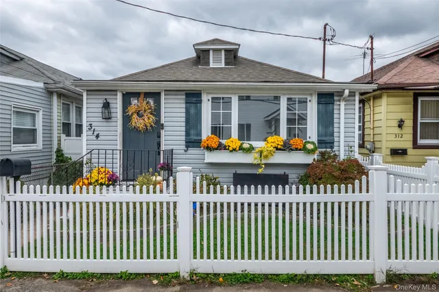 a front view of a house with a porch