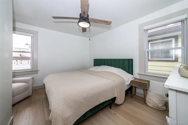 a bedroom with a bed and a chair