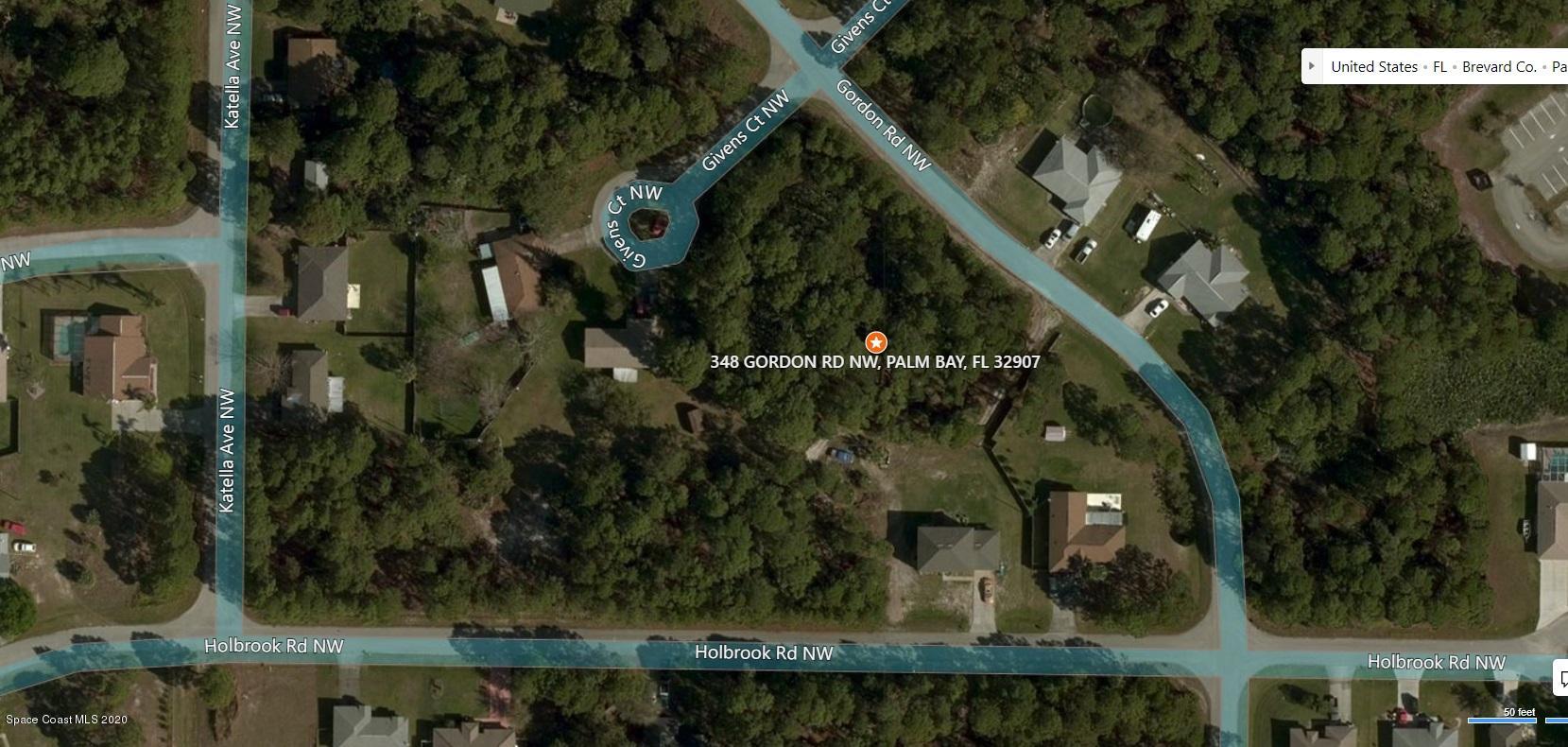 348 Gordon Road Northwest Palm Bay, FL 32907 - Photo 5 of 7 an aerial view of a residential houses with outdoor space