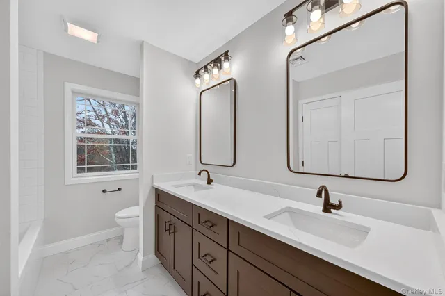 a bath tub sitting next to a window
