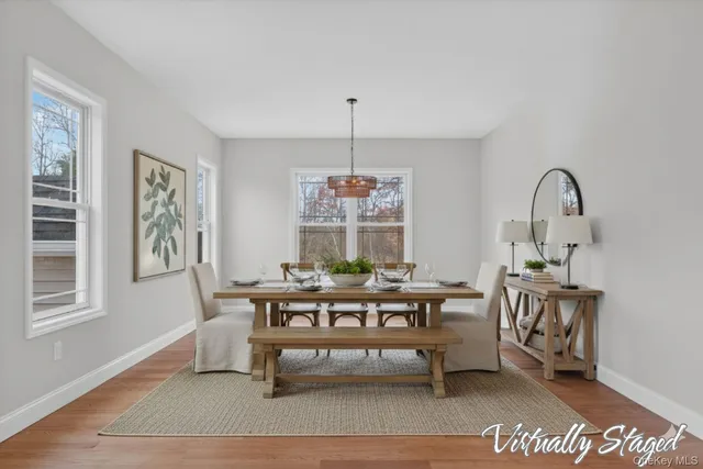 a kitchen with stainless steel appliances granite countertop a stove a sink and a white cabinets