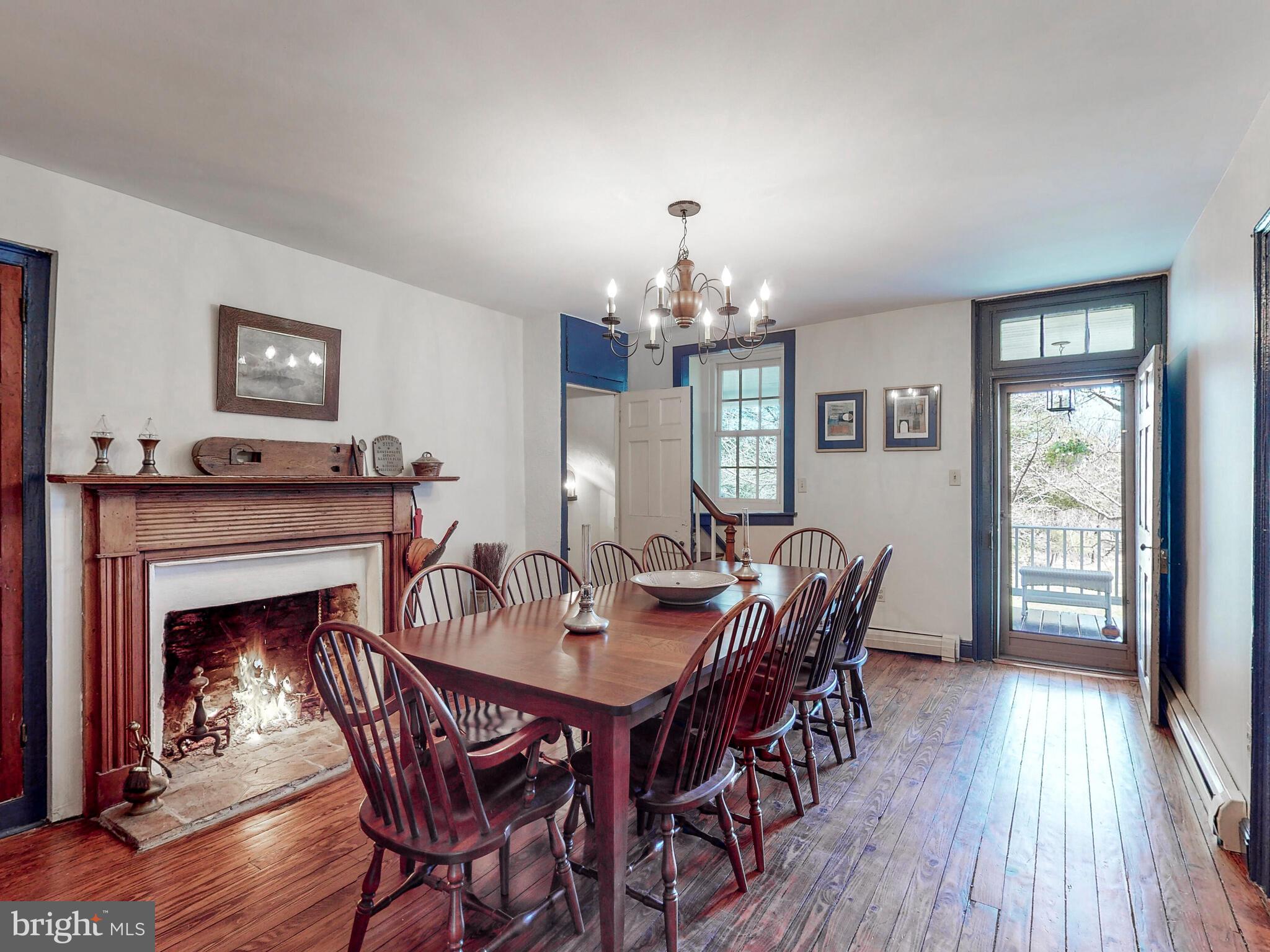1901 Brighton Dam Road Brookeville, MD 20833 - Photo 24 of 92 Dining room with fireplace & door to covered porch