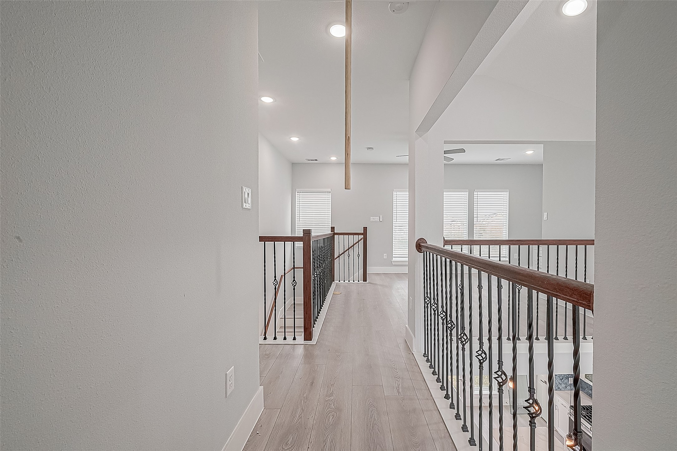 9204 Buffum Street Houston, TX 77051 - Photo 17 of 19 a view of a hallway with wooden floor