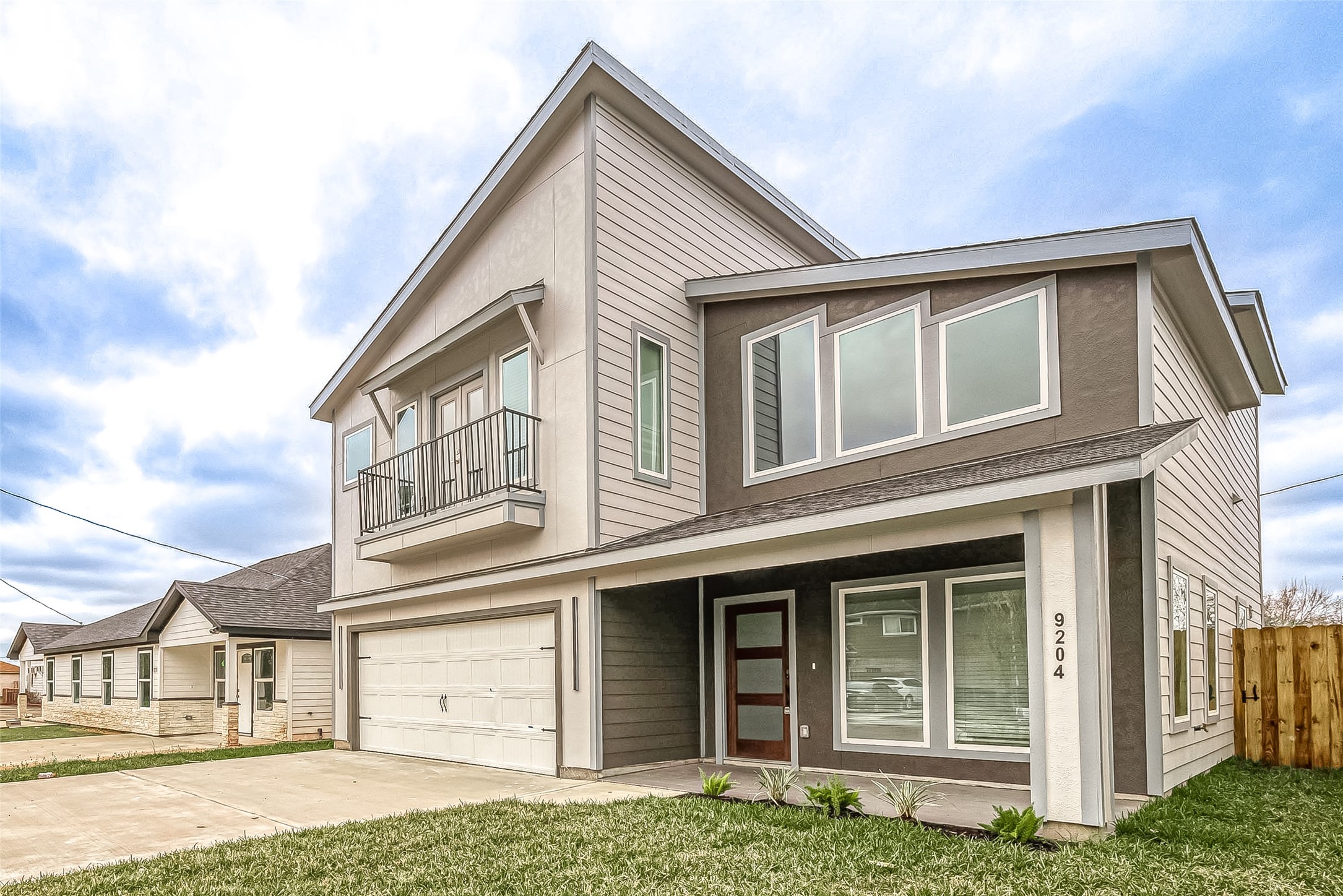 9204 Buffum Street Houston, TX 77051 - Photo 2 of 19 a front view of a house with a garden