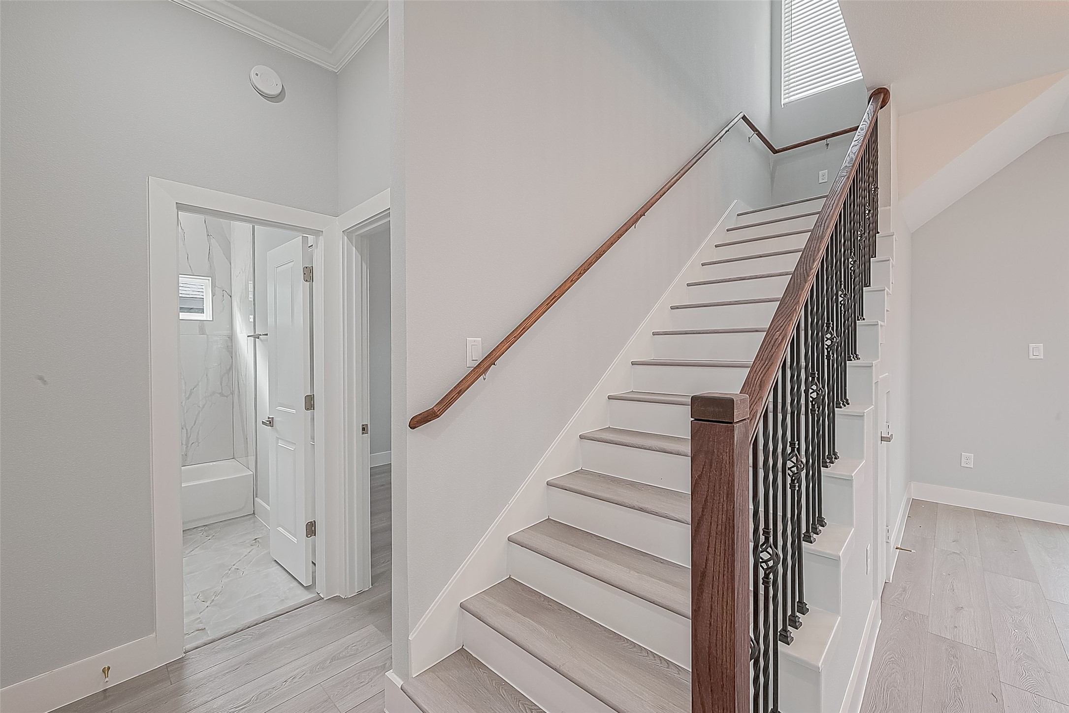 9204 Buffum Street Houston, TX 77051 - Photo 9 of 19 a view of entryway with wooden floor and stairs