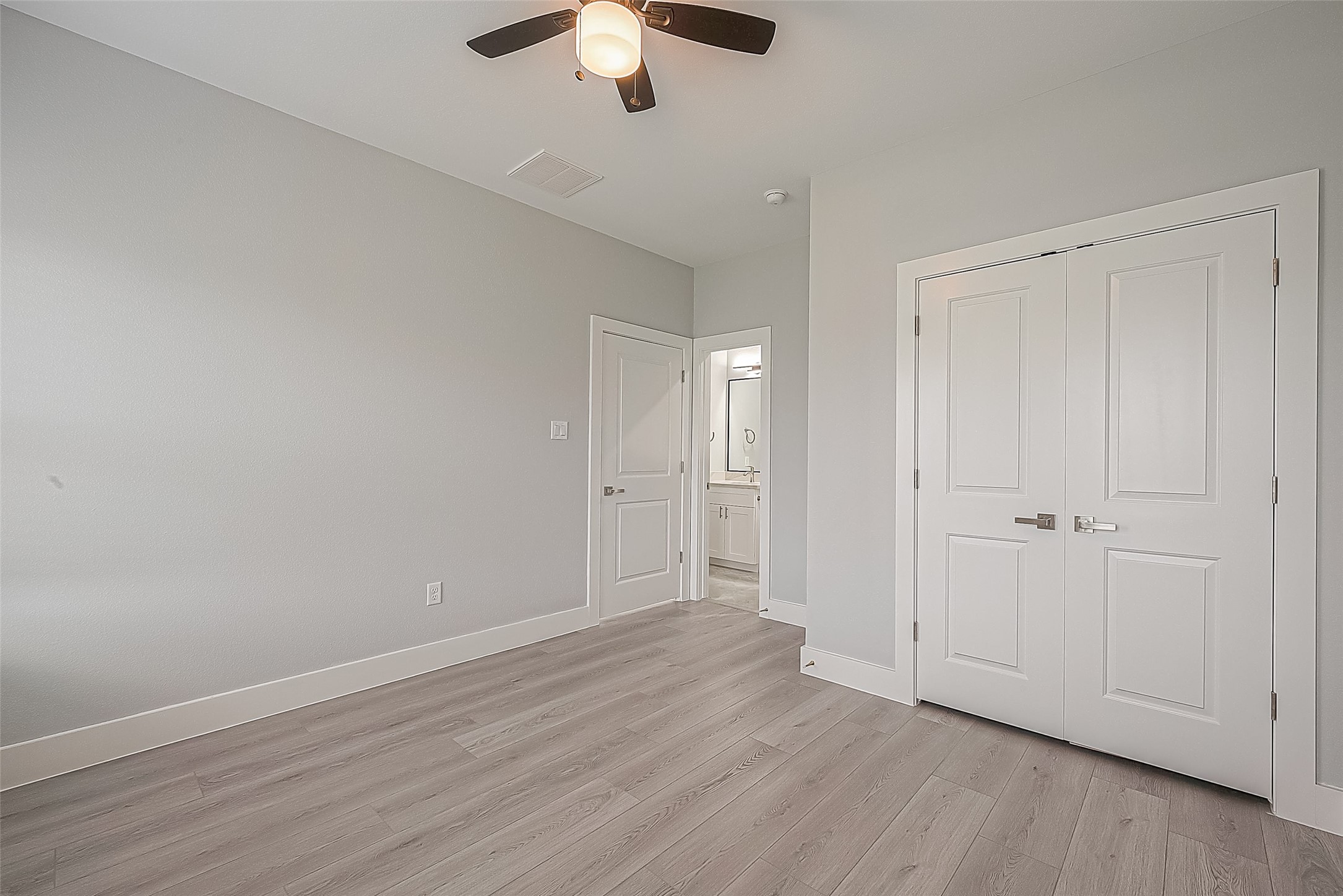 9204 Buffum Street Houston, TX 77051 - Photo 10 of 19 a view of an empty room with wooden floor
