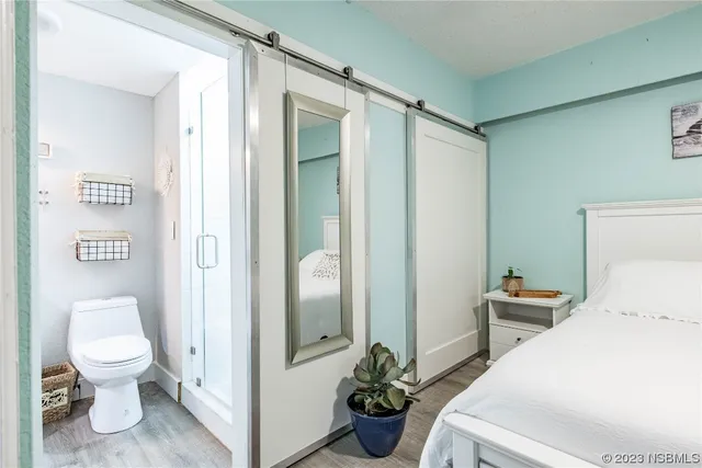 a view of a hallway with washer and dryer