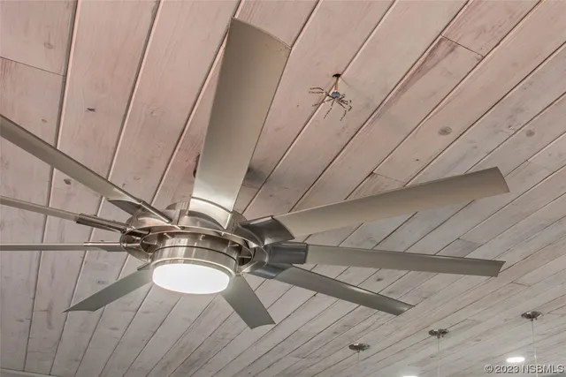 a kitchen with granite countertop a stove a refrigerator and a microwave