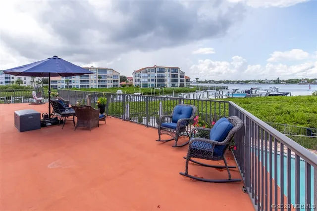 a balcony with outdoor seating