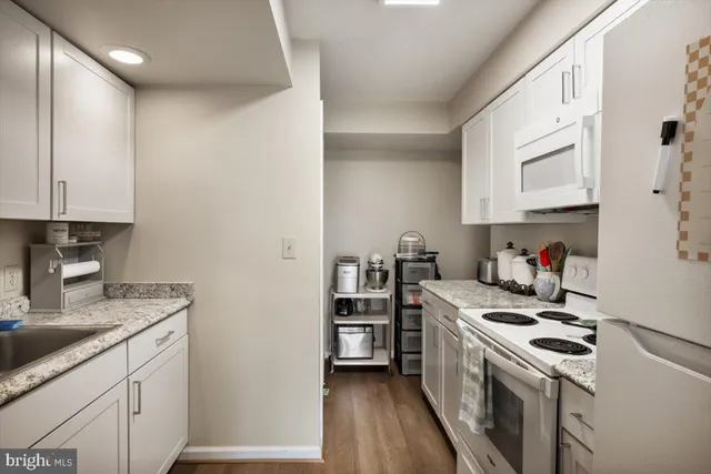 a view of a hallway with washer and dryer