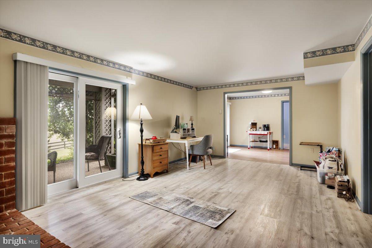 19606 Ridgeside Road Bluemont, VA 20135 - Photo 47 of 81 a living room with furniture and a wooden floor