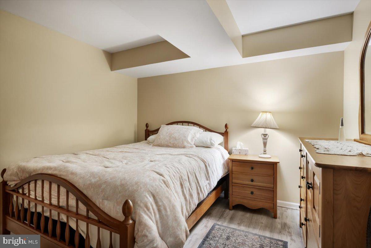 19606 Ridgeside Road Bluemont, VA 20135 - Photo 48 of 81 a bedroom with a bed and a lamp